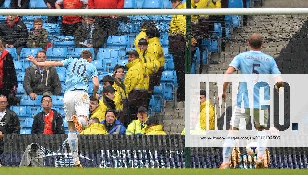Edin Dzeko of Manchester City scores the third goal - Barclays Premier League - Manchester City v Southampton - Etihad Stadium - Manchester - England - 5th April 2014 - Pic Simon Bellis Sportimage .