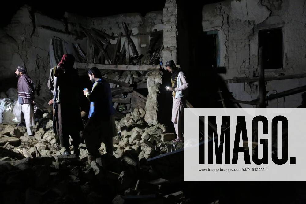 (220622) -- PAKTIKA (AFGHANISTAN), June 22, 2022 -- People stand on the rubble of a house damaged in an earthquake in Paktika province, Afghanistan, on June 22, 2022. The death toll from an earthquake that struck eastern Afghanistan early Wednesday has surpassed 1,000, while more than 1,500 people were injured, a provincial official said, adding the number of casualties might rise further. (Photo by Xinhua) AFGHANISTAN-PAKTIKA-EARTHQUAKE SaifurahmanxSafi
