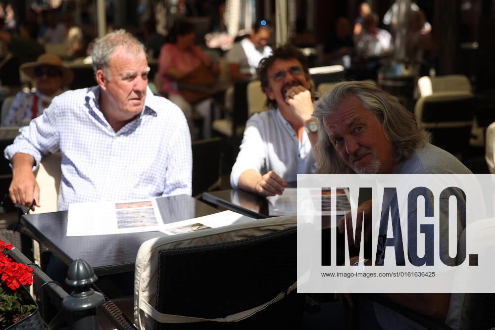 The Grand Tour stars, Jeremy Clarkson, Richard Hammond and James May, sit at a coffee shop on the Main Square in Cracow, Poland, while on tour filming the show. The Grand Tour is a British motoring television series, created by Jeremy Clarkson, Richard Hammond, James May, and Andy Wilman, made for Amazon exclusively for its online streaming service Amazon Prime Video which premiered in 2016. The programme was conceived in the wake of the departure of Clarkson, Hammond, May and Wilman from the BBC series Top Gear. Krakow Poland - ZUMAs197 20220624_zaa_s197_605