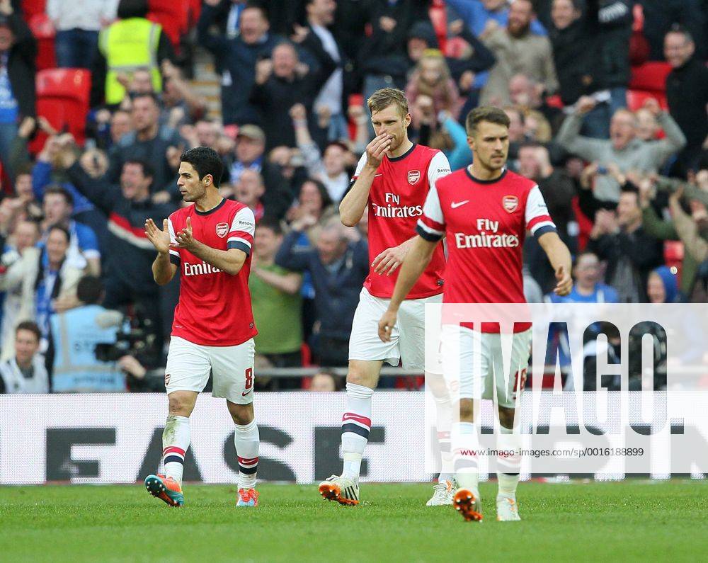 Arsenal s Per Mertesacker looks on dejected after conceding a penalty Wigan Athletic vs Arsenal- FA Cup Semi Final, Wembley Stadium - London - England - 12 04 2014 - Pic David Klein Sportimage .