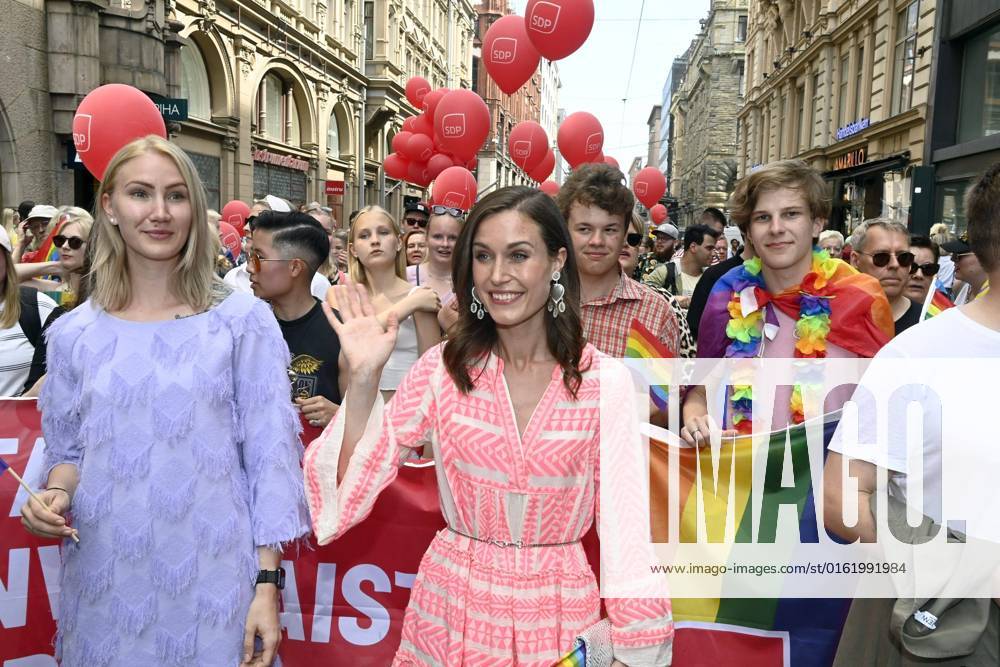 Finnish Prime Minister Sanna Marin (C) participates in the Helsinki Pride 2022 march in Helsinki, Finland, on July 2, 2022. Helsinki Finland