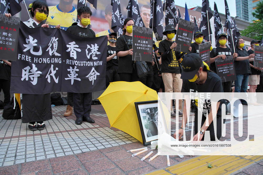 KW26 Protester offer flowers during a rally against Communist China s government in Tokyo, Japan on July 2, 2022. Hong Kong marked 25 years since handover from Britain to China on July 1. TKP2022070208 KEIZOxMORI