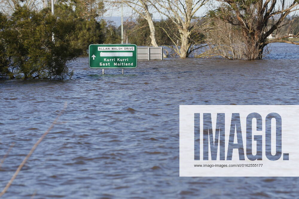 FLOODING NSW CLEAN UP, Allan Walsh Drive under floodwaters in Maitland, Saturday, July 9, 2022. Clean-up work has begun in many soaked NSW regions, but 40,000 people remain under evacuation orders amid the danger of still-rising waters. ( NO ARCHIVING, , NO USE IN BOOKS WITHOUT CONSENT MAITLAND NSW AUSTRALIA