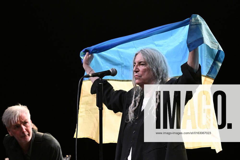 American singer and musician Patti Smith performs during her concert in Prague, Czech Republic, on July 19, 2022. On the photo Smith holds the Ukrainian flag. (CTKxPhoto MichalxKamaryt) CTKPhotoP2022071907992 kmt