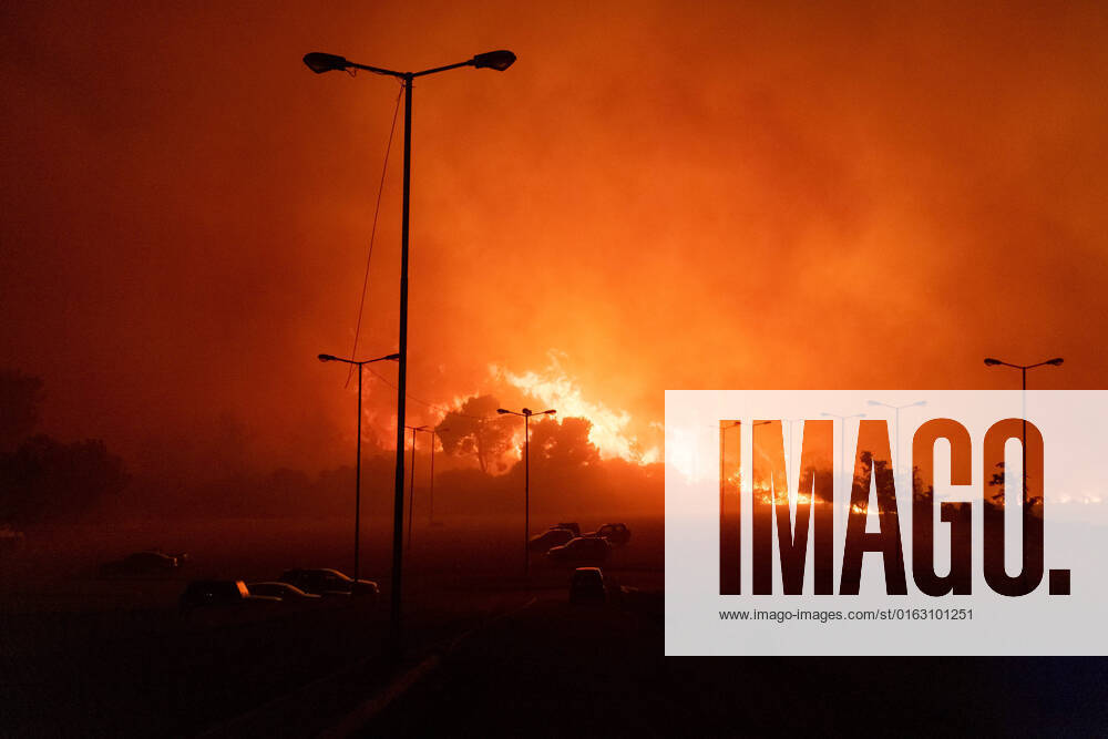 (220720) -- ATHENS, July 20, 2022 -- A wildfire rages at night in the northeastern suburbs of Athens, Greece, July 20, 2022. A massive wildfire broke out Tuesday in the northern suburbs of Athens, damaging homes and forcing evacuations of local communities. (Photo by Xinhua) GREECE-ATHENS-WILDFIRE LefterisxPartsalis