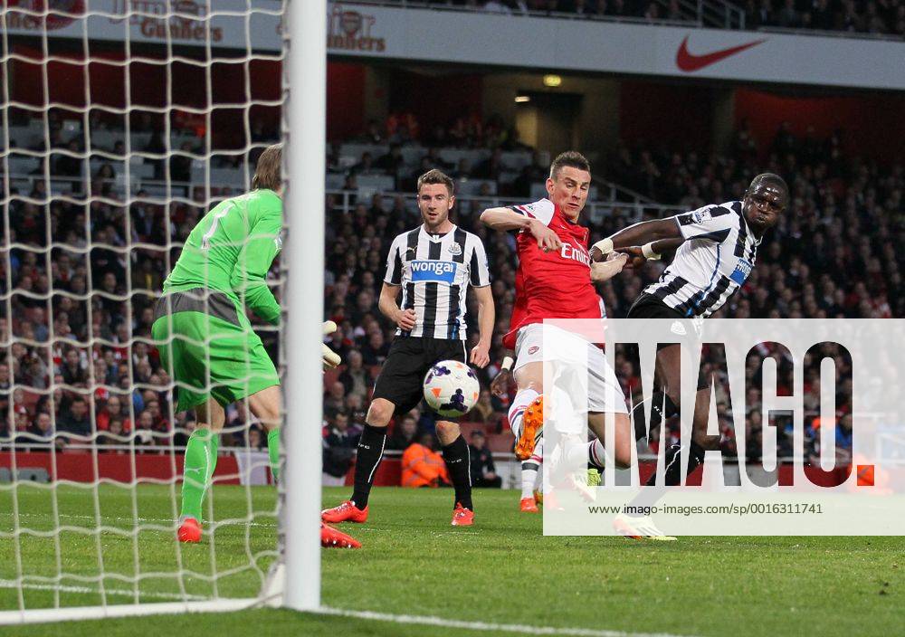 Arsenal s Laurent Koscielny scoring his sides opening goal Arsenal vs Newcastle United - Barclays Premier League - Emirates Stadium - London - UK - 28 04 2014 - Pic David Klein Sportimage .
