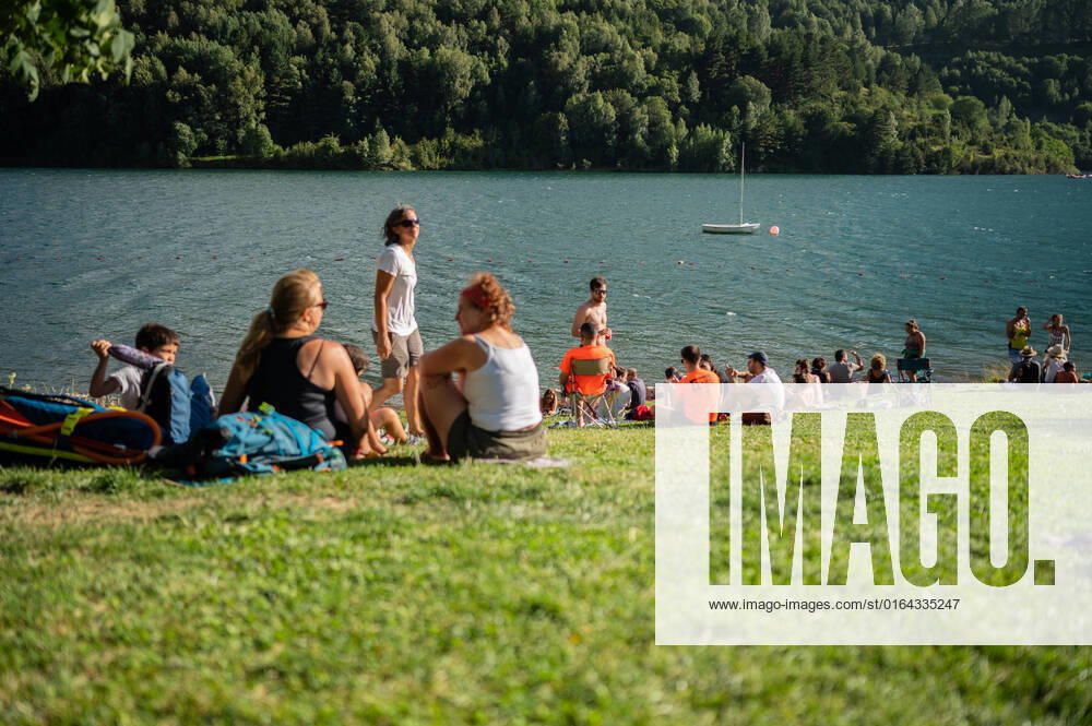 People enjoy a sunny summer day at Lanuza reservoir in Sallent de Gallego, Huesca, Spain Sallent de Gallego Huesca Spain