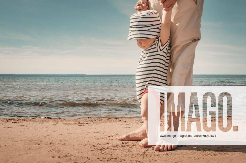 Little baby boy walking on the beach in summer day, Nine month old baby boy walking on the beach in beautiful summer day, Nine month old baby boy walking on the beach in beautiful summer day model released, Symbolfoto , 01.11.2020,