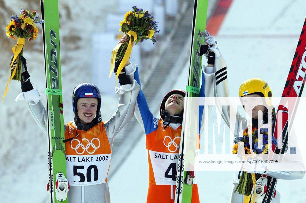 Feb. 13, 2002 - U.S. - KRT SPORTS STORY SLUGGED: OLY-SKIJUMP: KRT PHOTOGRAPH BY JOE RIMKUS JR. MIAMI HERALD (February 13) SALT LAKE CITY, UT-- Medal winners Adam Malysz, of Poland, silver; Simon Ammann, Switzerland, gold; and Matti Hannawald, Finland, bronze in the flower ceremony of the mens Ski Jumping Individual K120 at Utah Olympic Park Wednesday February 13, 2002. (MI) NC KD - Feb. 13, 2002 - ZUMAm67