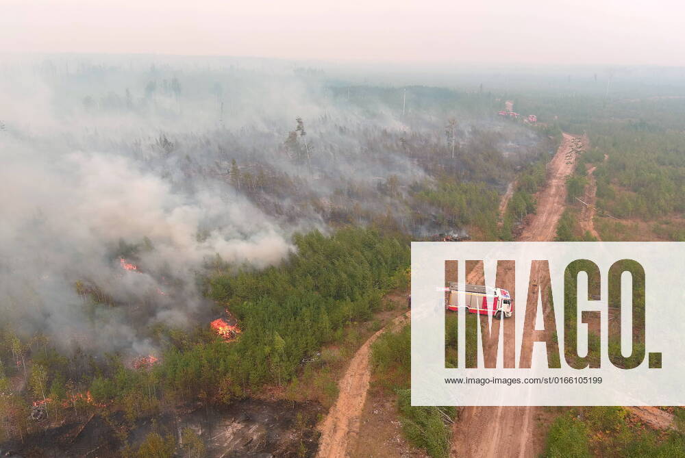 Smoke billows from a wildfire. The Russian Emergencies Ministry sent a Beriev Be-200 amphibious aircraft, two Ilyushin Il-76 airlifters, a Mil Mi-26 helicopter and three Mil Mi-8 helicopters to Russia s Ryazan Region to battle wildfires. A fire covers an area of 500 hectares in the Spassky District, Ryazan Region; a state of emergency is declared. Alexander Ryumin TASS TS13E97E
