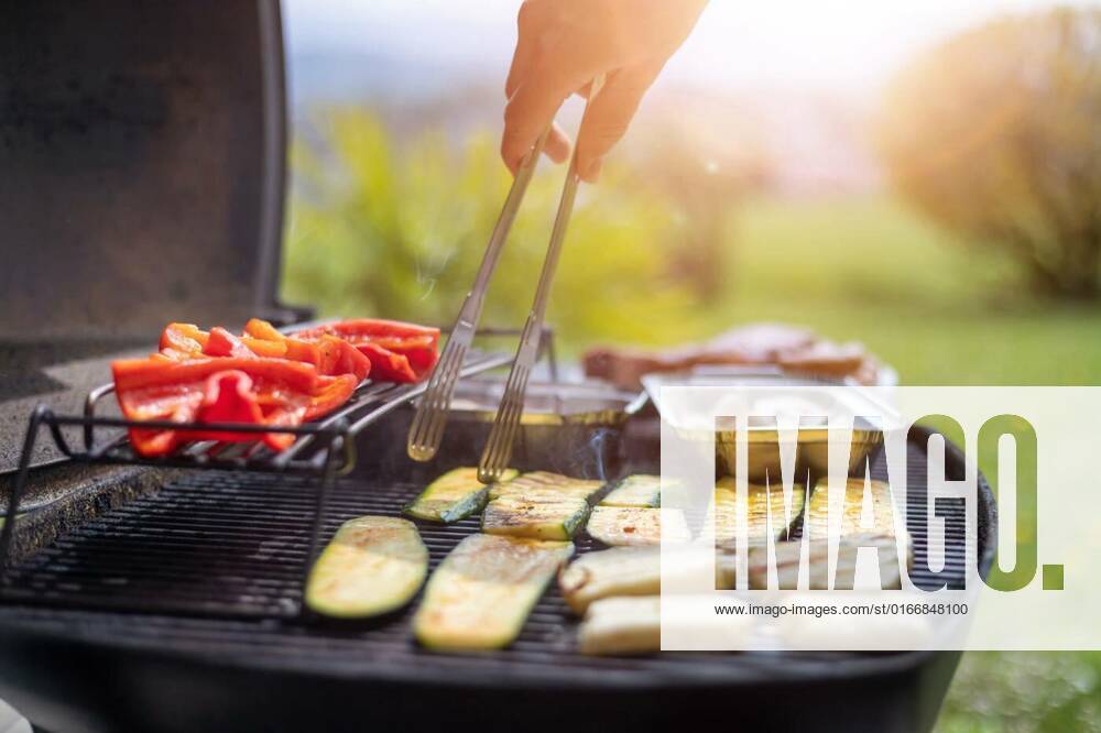 Vegetarian BBQ on weekend. Grill cheese and vegetables on gas grill. Outdoors., Close up of cheese and vegetables on gas grill. Summer time, outdoors., 02.05.2021,