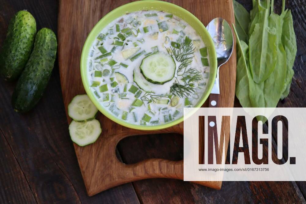 Cold soup with cucumbers, yogurt, sorrel and fresh herbs on the wooden rustic table, Cold soup with cucumbers, yogurt, sorrel and fresh herbs on the wooden rustic table ., Cold soup with cucumbers, yogurt, sorrel and fresh herbs on the wooden rustic table ., 01.09.2021,