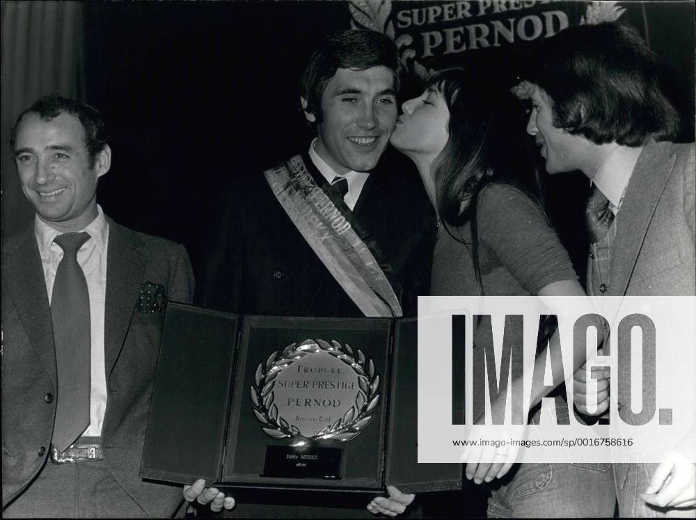 Nov. 15, 1974 - Cycling champion, Eddy Merckx received the Super Prestige Pernod trophy and 35,000 Francs at a hotel in Paris yesterday. He is pictured here being congratulated. - ZUMAk09