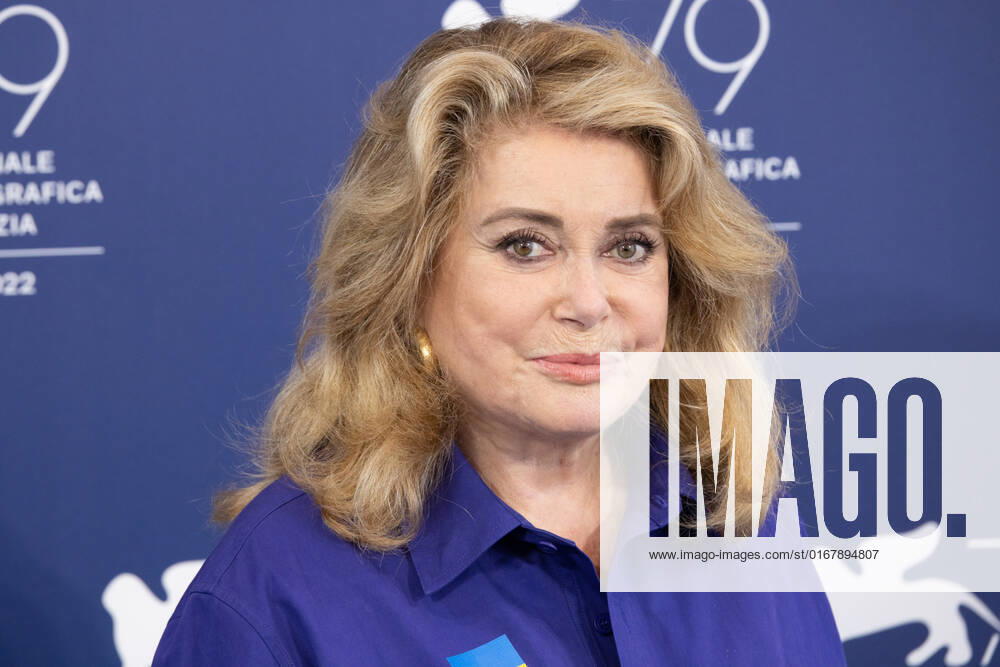 French actress Catherine Deneuve, wearing a flag of Ukraine on her shirt, poses on August 31, 2022, during a photocall for the Golden Lion for Lifetime Achievement she is to be awarded, on the opening day of the 79th Venice International Film Festival at Venice Lido. Â Photo: Cinzia Camela.