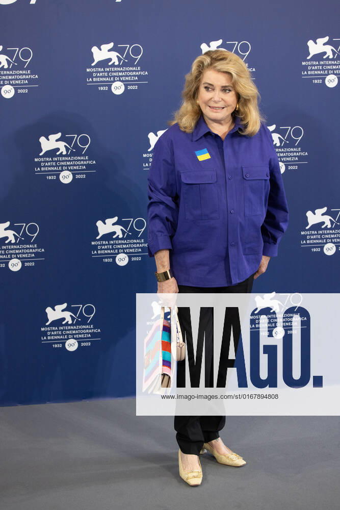 French actress Catherine Deneuve, wearing a flag of Ukraine on her shirt, poses on August 31, 2022, during a photocall for the Golden Lion for Lifetime Achievement she is to be awarded, on the opening day of the 79th Venice International Film Festival at Venice Lido. Â Photo: Cinzia Camela.