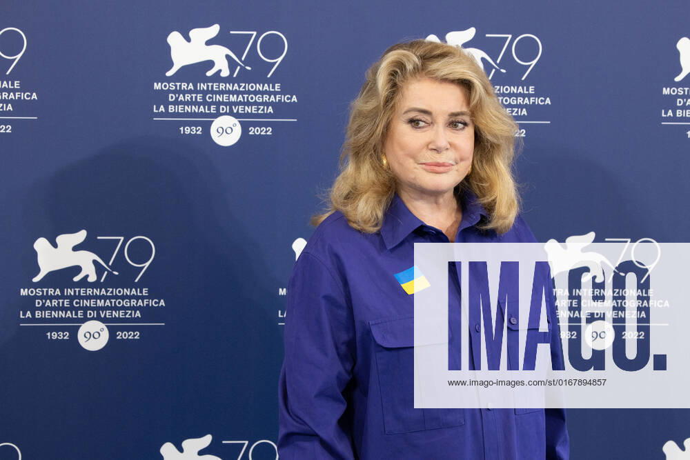 French actress Catherine Deneuve, wearing a flag of Ukraine on her shirt, poses on August 31, 2022, during a photocall for the Golden Lion for Lifetime Achievement she is to be awarded, on the opening day of the 79th Venice International Film Festival at Venice Lido. Â Photo: Cinzia Camela.