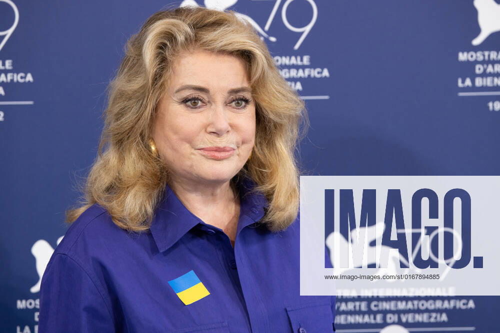 French actress Catherine Deneuve, wearing a flag of Ukraine on her shirt, poses on August 31, 2022, during a photocall for the Golden Lion for Lifetime Achievement she is to be awarded, on the opening day of the 79th Venice International Film Festival at Venice Lido. Â Photo: Cinzia Camela.