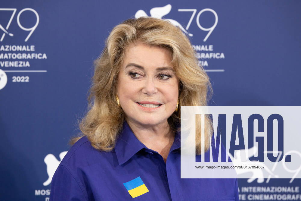 French actress Catherine Deneuve, wearing a flag of Ukraine on her shirt, poses on August 31, 2022, during a photocall for the Golden Lion for Lifetime Achievement she is to be awarded, on the opening day of the 79th Venice International Film Festival at Venice Lido. Ã‚ Photo: Cinzia Camela.