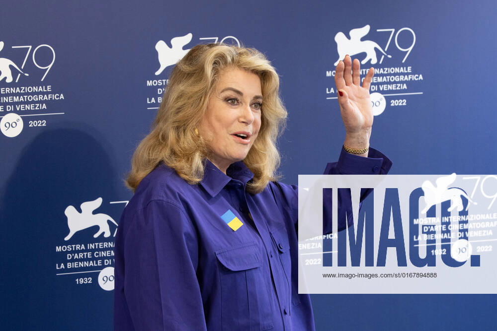 French actress Catherine Deneuve, wearing a flag of Ukraine on her shirt, poses on August 31, 2022, during a photocall for the Golden Lion for Lifetime Achievement she is to be awarded, on the opening day of the 79th Venice International Film Festival at Venice Lido. Â Photo: Cinzia Camela.