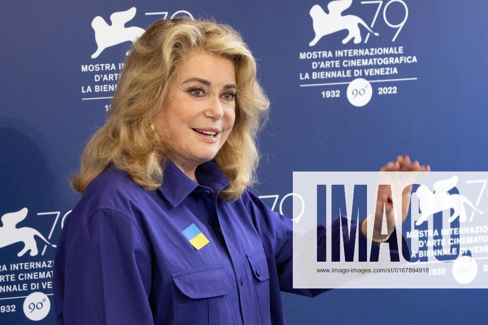 French actress Catherine Deneuve, wearing a flag of Ukraine on her shirt, poses on August 31, 2022, during a photocall for the Golden Lion for Lifetime Achievement she is to be awarded, on the opening day of the 79th Venice International Film Festival at Venice Lido. Â Photo: Cinzia Camela.