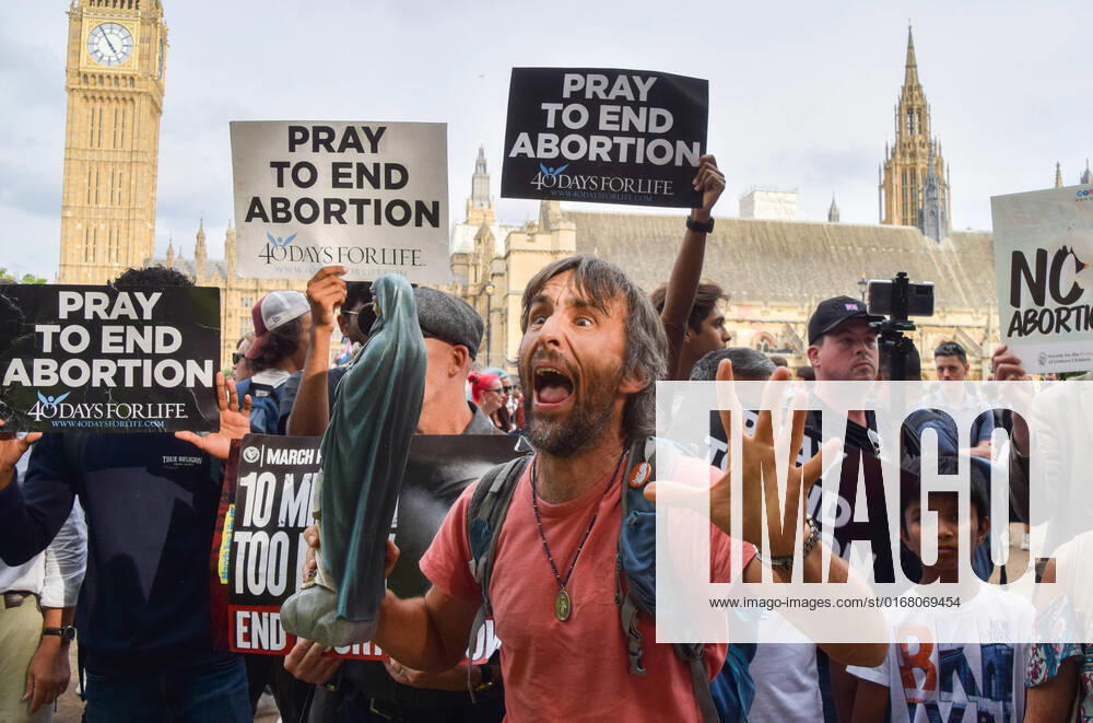 An anti-abortion protester holds a statue of the Virgin Mary. Pro-choice protesters gathered in Parliament Square as the March For Life, an anti-abortion rally, was taking place. Anti-abortion groups in the UK have been emboldened by the events in USA, with reports suggesting that US interest groups have been financing anti-abortion campaigns in the UK. London United Kingdom - ZUMAv130 20220903_zip_v130_036