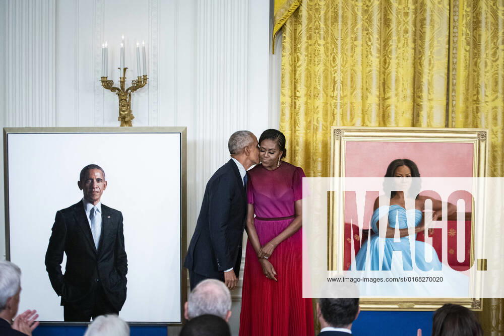 Former President Barack Obama kisses former First Lady Michelle Obama as their official White House portraits are unveiled in the East Room of the White House in Washington, DC on Wednesday, September 7, 2022. The portraits of the former president and first lady were painted by Robert McCurdy and Sharon Sprung, respectively. WAP20220907537 AlxDrago