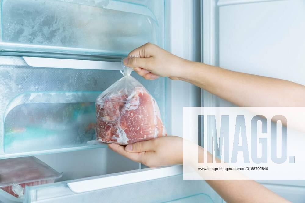 Taking frozen meat from the modern no-frost freezer, Taking frozen meat from the modern no-frost freezer, Taking frozen meat from the modern no-frost freezer, 09.11.2021,