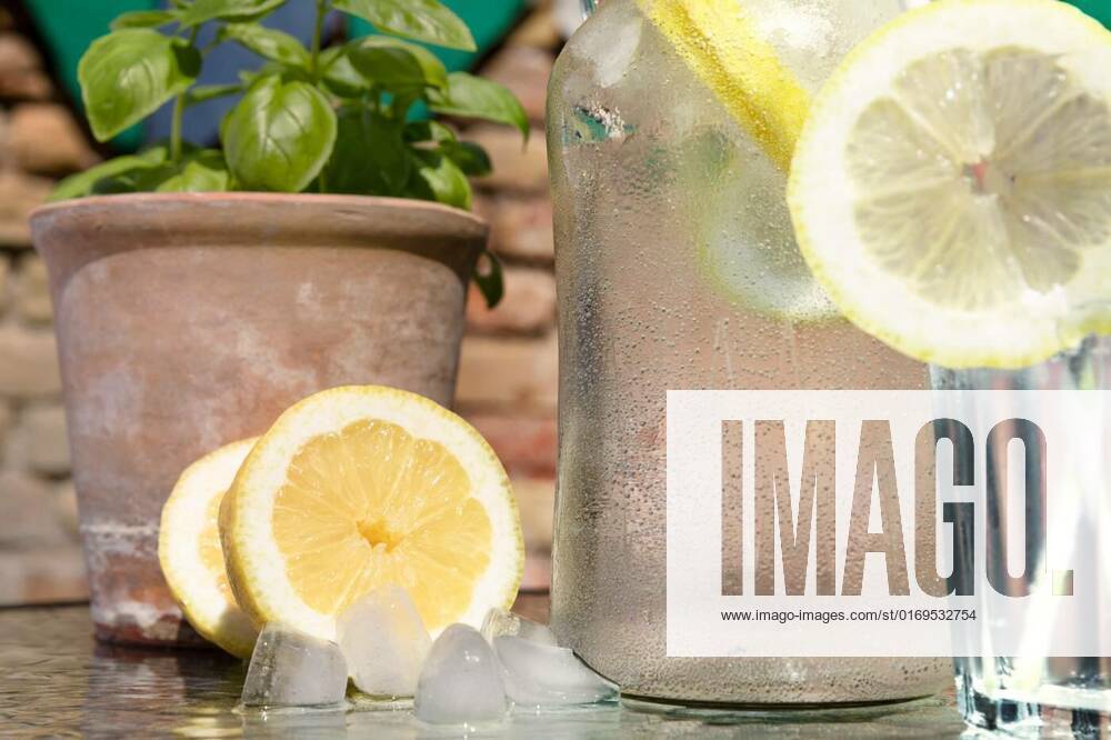 Water fresh and cold in a hot summer day with ice cubes and lemon. Heat dehydration concept. Placed in front of old brick wall., Water fresh and cold in a hot summer day with ice cubes and lemon. Heat dehydration concept. Placed in front of old brick wall., Water fresh and cold in a hot summer day with ice cubes and lemon. Heat dehydration concept. Placed in front of old brick wall., 26.06.2022,