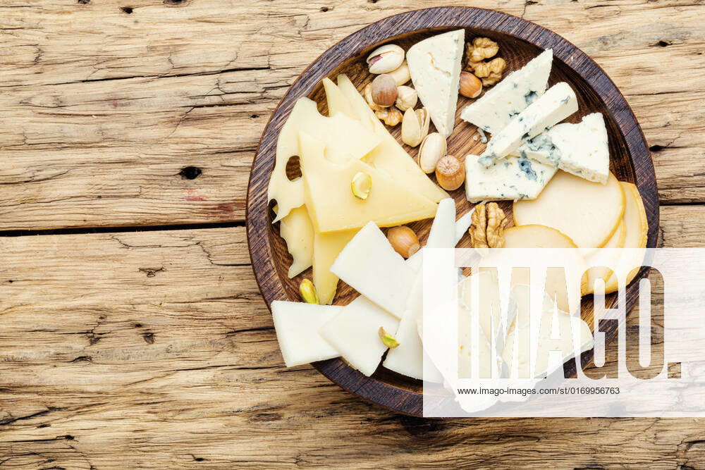 Cheese on the table.various types of cheese on old rustic wooden table , 28798434.jpg, different, cheese, piece, slice, kinds, snack, assorted, sliced, cutting, appetizer, delicatessen, product, delicious, fresh, cut, parmesan, tasty, italian, cheddar, meal, food, brie, swiss, breakfast, assortment, milk, hole, eating, dairy, part, portion, holland, triangle, set, dinner, tray, plate, cheese board, cheese platter, piece cheese, wooden, wooden table, copy space, space,