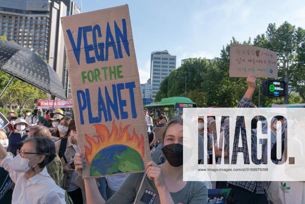 Climate Justice March In Seoul A protester holds a placard saying Vegan for the Planet. at Climate Justice March around Gwanghwamun area on September 24, 2022 in Seoul, South Korea. The demonstration demanded the government to stop using Fossil Energy system and climate justice. About 10,000 people by The Police s estimate (35,000 people by The Organizer s estimate) gathered at the demonstration on the day. Seoul South Korea