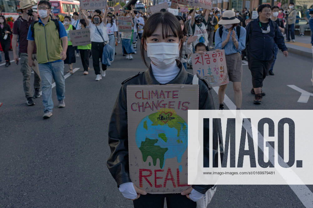 Climate Justice March In Seoul A protester holds a placard saying Climate Change is Real at Climate Justice March around Gwanghwamun area on September 24, 2022 in Seoul, South Korea. The demonstration demanded the government to stop using Fossil Energy system and climate justice. About 10,000 people by The Police s estimate (35,000 people by The Organizer s estimate) gathered at the demonstration on the day. Seoul South Korea