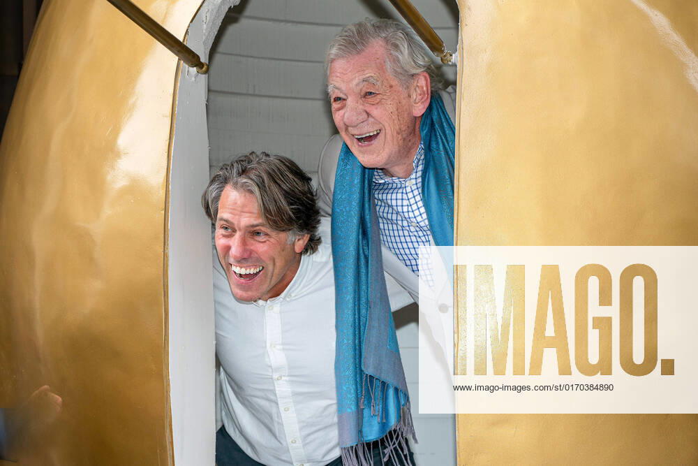 (L-R) John Bishop and Ian McKellen pop their heads out of the giant golden egg. Sir Ian McKellen, John Bishop, and Mel Giedroyc Launched the UK and Ireland tour of Mother Goose outside The Londoner Hotel in London. Mel Giedroyc hosted the event to announce the cast for the show. To mark the occasion Ian McKellen and John Bishop hid in a big golden egg placed outside and Mel opened the hatch on the egg to reveal the pair that have been cast. London United Kingdom - ZUMAs197 20221003_zaa_s197_179