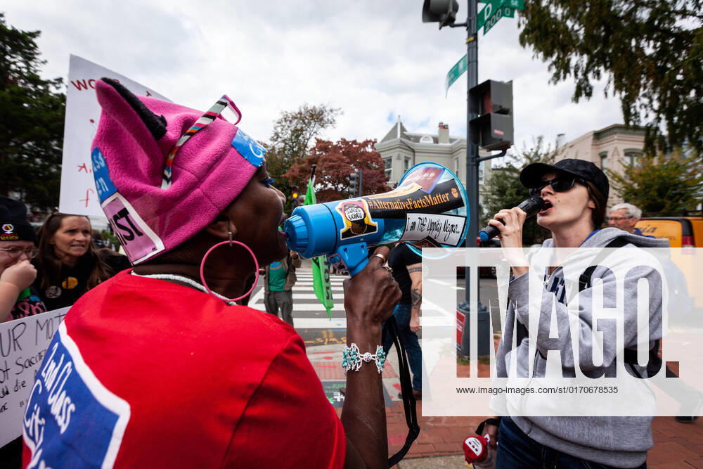Women s March for Reproductive Rights in Washington, DC Pro-choice (left) and anti-abortion (right) activists discuss abortion via megaphone and microphone at the Women s March for reproductive rights, abortion access, and bodily autonomy. This was the flagship event of a nationwide Women s Wave protest in hundreds of cities across the United States on October 8, 2022. The Women s March organized the demonstrations in response to the Supreme Court s Dobbs v. JWHO opinion, which overturned Roe v. Wade, eliminating the federal right to abortion access. Washington DC United States