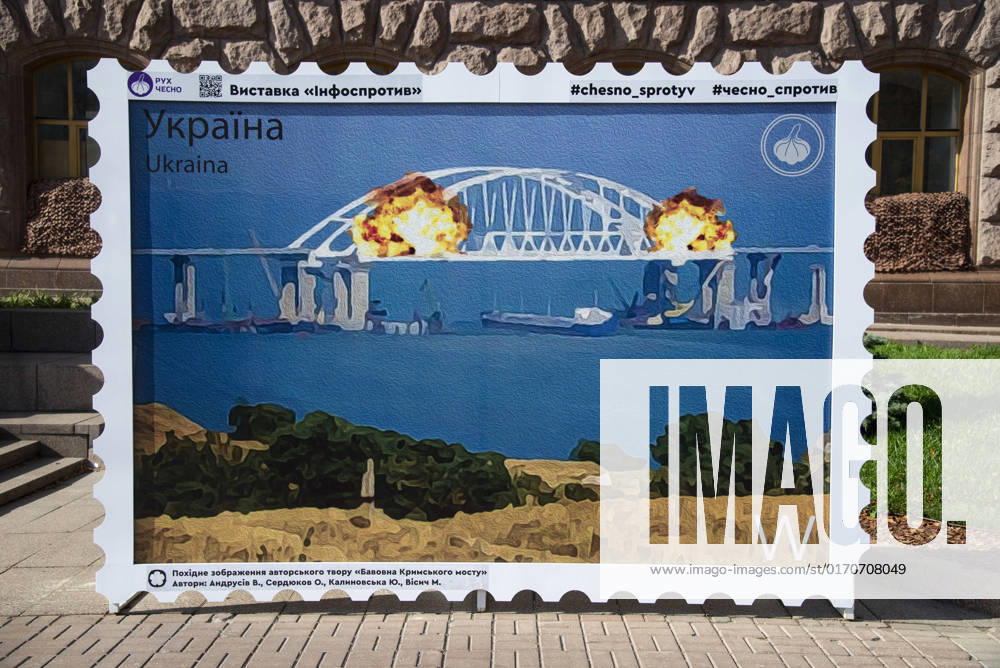 A large illustration of a stamp, showing destruction of Crimean bridge is seen in downtown Kyiv. On October 8, several sections of the bridge were destroyed and a train with fuel, that was moving on the railway part of the bridge, caught fire. Russia annexed Crimea March 18, 2014 to begin their war on peaceful Ukraine. Russia started the full-scale invasion of Ukraine on February 24, 2022. Kyiv Ukraine - ZUMAa213 20221009_zip_a213_003