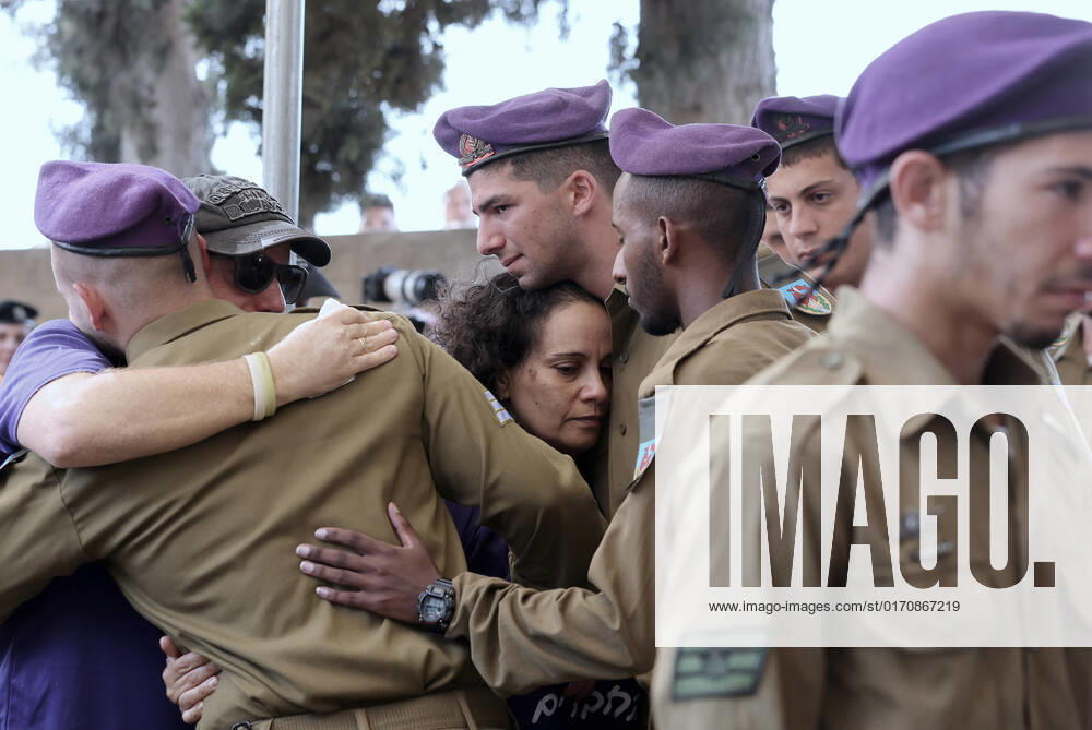(221012) -- GEDERA (ISRAEL), Oct. 12, 2022 -- Soldiers and relatives attend the funeral of an Israeli soldier at the military cemetery in Gedera, central Israel, on Oct. 12, 2022. The Israeli soldier was killed in a drive-by shooting attack in the occupied West Bank on Tuesday, amid escalating violence between Israel and the Palestinians. ( via Xinhua) ISRAEL-GEDERA-SOLDIER-FUNERAL IlanxAssayag JINI