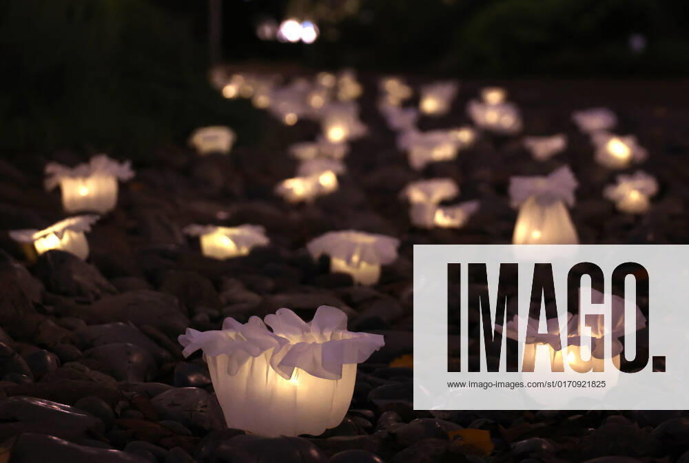 Tokyo, Japan - An installation as it is. -equilibrium flower- of some 2,000 flower like objects with small LED lights is displayed at a park of the Tokyo Midtown as a part of the Tokyo Midtown Design Touch 2022 in Tokyo on Friday, October 14, 2022. An annual design event with the theme of Design for Sustainable Future started at the Tokyo Midtown through November 3. , aflo_201255383.jpg,