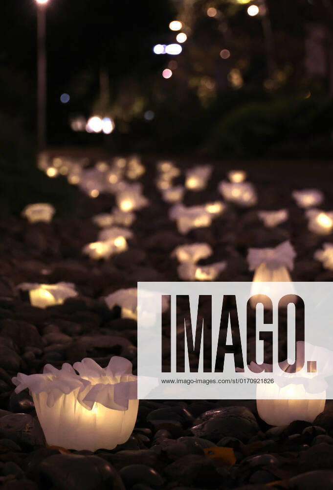 Tokyo, Japan - An installation as it is. -equilibrium flower- of some 2,000 flower like objects with small LED lights is displayed at a park of the Tokyo Midtown as a part of the Tokyo Midtown Design Touch 2022 in Tokyo on Friday, October 14, 2022. An annual design event with the theme of Design for Sustainable Future started at the Tokyo Midtown through November 3. , aflo_201255385.jpg,