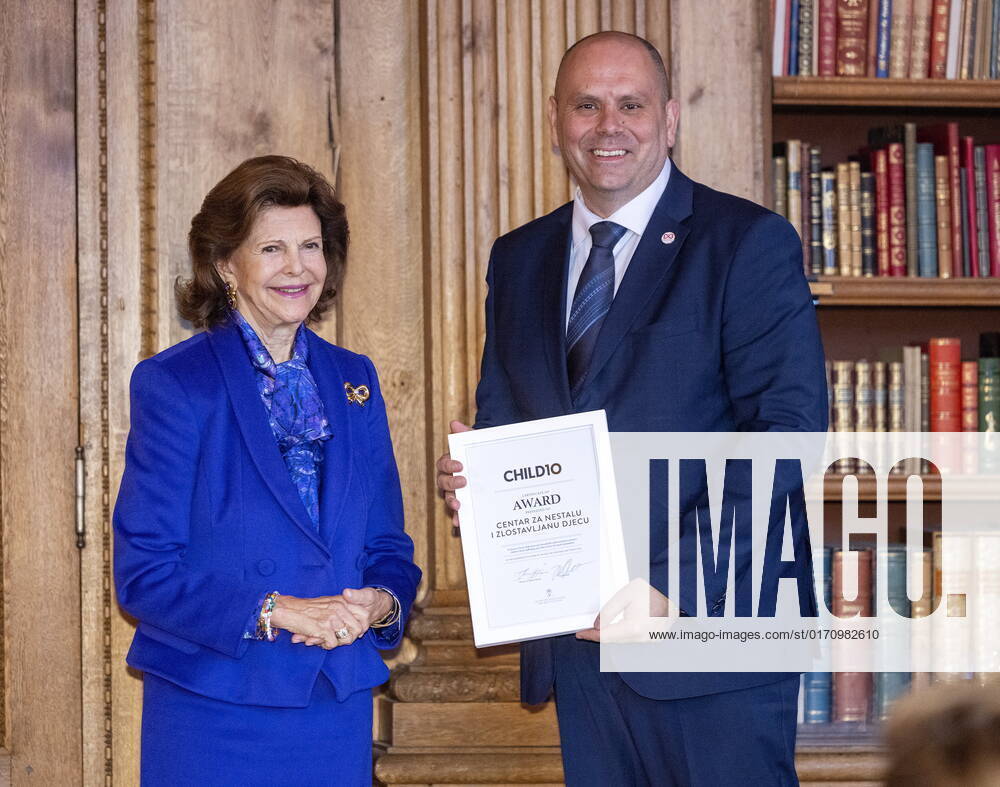 STOCKHOLM 20221018 Tomislav Ramljak from the Croatian organization Center for Missing and Exploited Children receives an award from Queen Silvia during the ceremony of the Child 10 award in the Bernadotte Library at Stockholm Palace STOCKHOLM SWEDEN