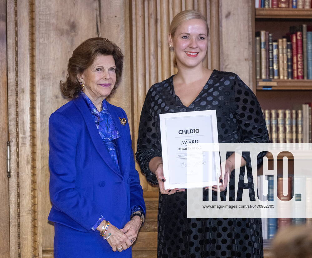 STOCKHOLM 20221018 Polona Kovac from the Slovenian organization KLJUC receives an award from Queen Silvia during the ceremony for the Child10 award in the Bernadotte Library at Stockholm Palace STOCKHOLM SWEDEN
