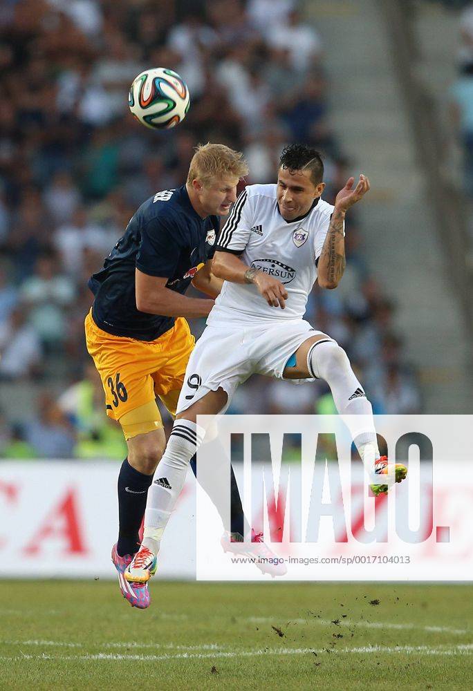SOCCER - CL, Karabag vs RBS BAKU,AZERBAIJAN,30.JUL.14 - SOCCER - UEFA Champions League, qualifying, Karabag Agdam FK vs Red Bull Salzburg. Image shows Martin Hinteregger (RBS) and Reynaldo (Karabag).