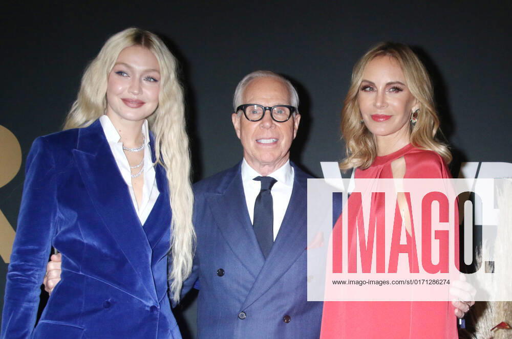NEW YORK, NY- OCTOBER 25: Gigi Hadid, Tommy Hilfiger and Dee Ocleppo at the WWD 2022 Honors Awards at Cipriani South Street in New York City on October 25, 2022.