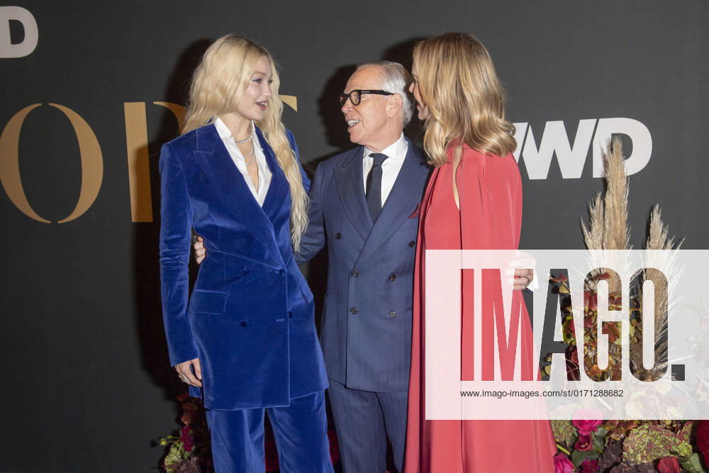 Gigi Hadid, Tommy Hilfiger and Dee Ocleppo Hilfiger attend 2022 WWD Honors at Cipriani South Street in New York City. New York United States - ZUMAs197 20221025_zaa_s197_341