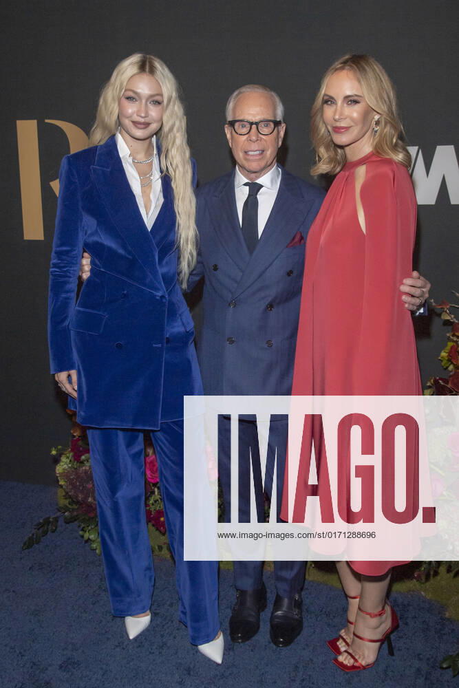 Gigi Hadid, Tommy Hilfiger and Dee Ocleppo Hilfiger attend 2022 WWD Honors at Cipriani South Street in New York City. New York United States - ZUMAs197 20221025_zaa_s197_338
