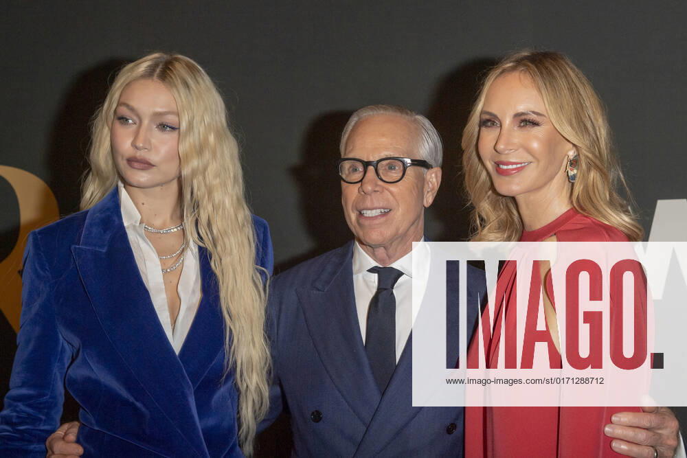 Gigi Hadid, Tommy Hilfiger and Dee Ocleppo Hilfiger attend 2022 WWD Honors at Cipriani South Street in New York City. New York United States - ZUMAs197 20221025_zaa_s197_336