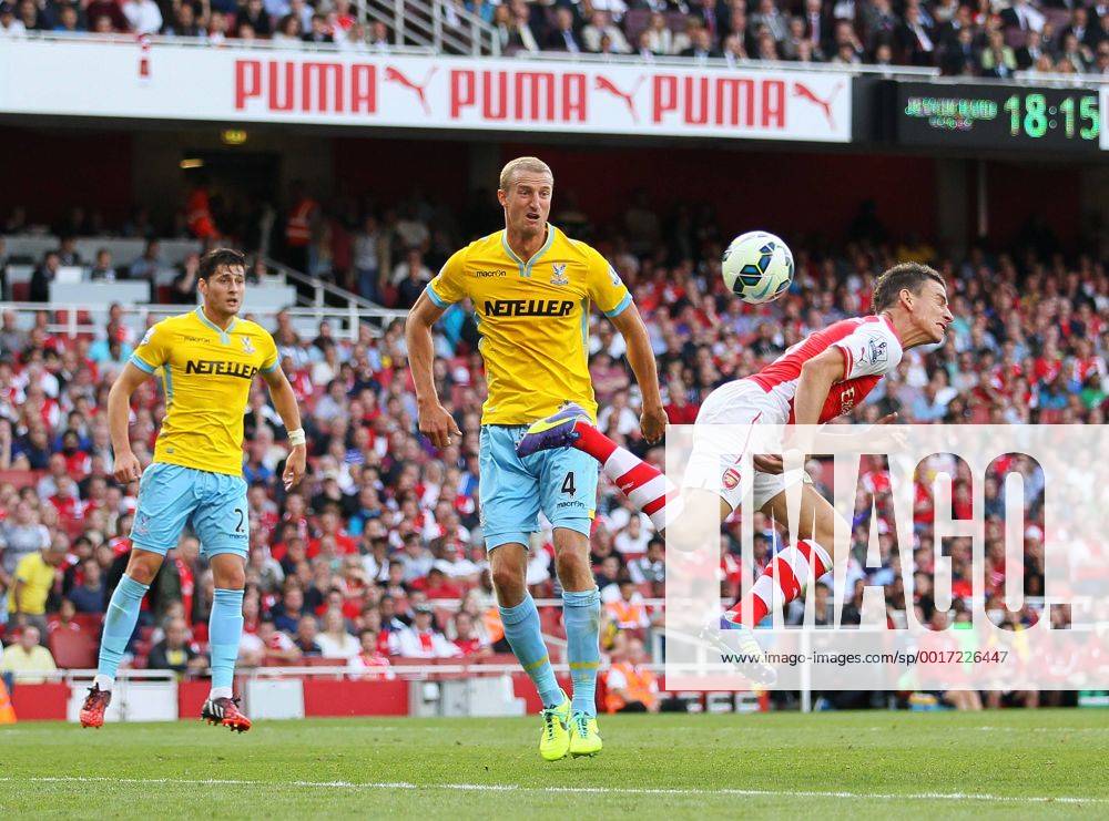 Arsenal s Laurent Koscielny scoring his sides opening goal - Barclays Premier League - Arsenal vs Crystal Palace - Emirates Stadium - London - England - 16th August 2014 - Picture David Klein Sportimage .