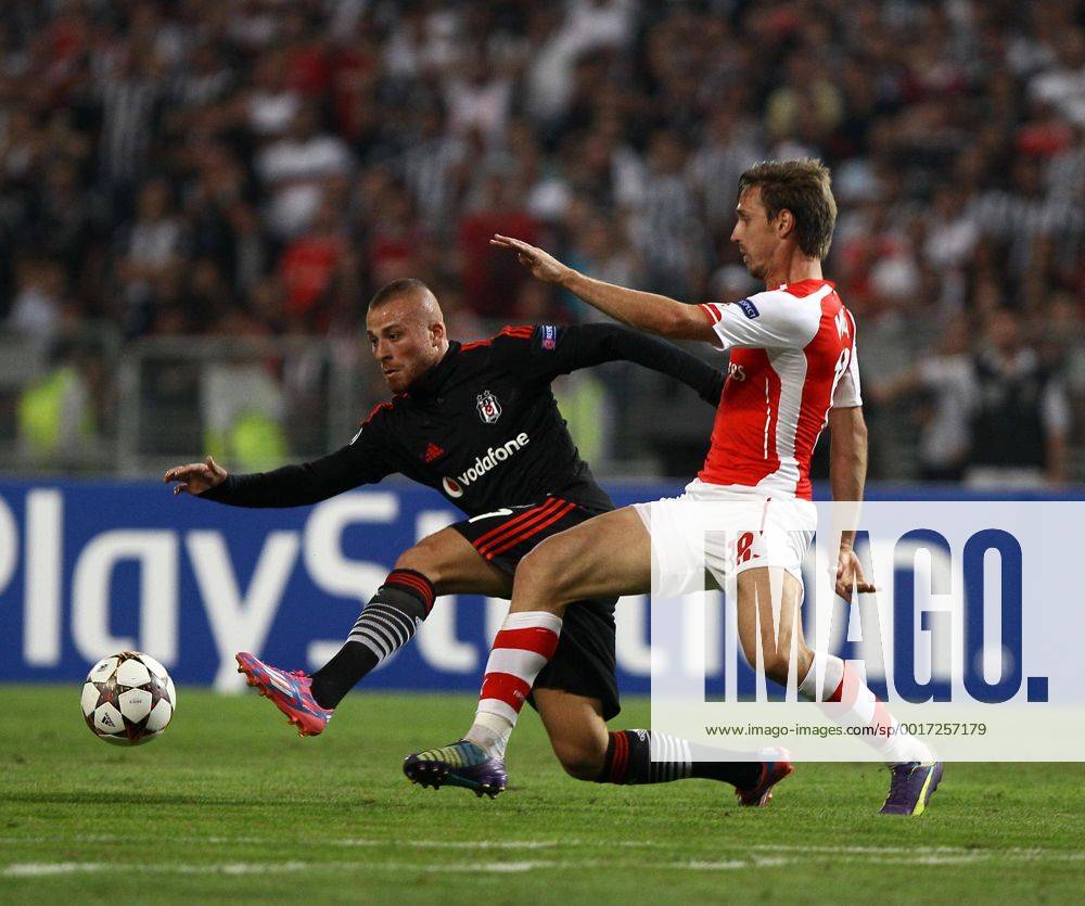 UEFA Champions League playoff first leg match match between Besiktas and Arsenal at Olympic stadium in istanbul 19 august 2014. Score: Besiktas 0 - Arsenal 0 Pictured: Gokhan Tore of Besiktas and Ignacio Nacho Monreal Eraso of Arsenal.
