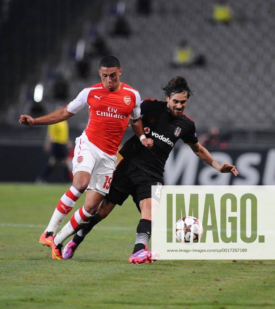 UEFA Champions League playoff first leg match match between Besiktas and Arsenal at Olympic stadium in istanbul 19 august 2014. Score: Besiktas 0 - Arsenal 0 Pictured: Alexander (Alex) Mark David Oxlade Chamberlain of Arsenal and Veli Kavlak of Besiktas.
