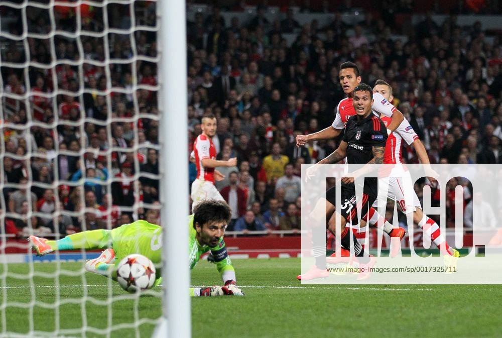 Arsenal s Alexis Sanchez scoring his sides opening goal - UEFA Champions League, Play-off Second Leg - Emirates Stadium - England - 27th August 2014 - Picture David Klein Sportimage .