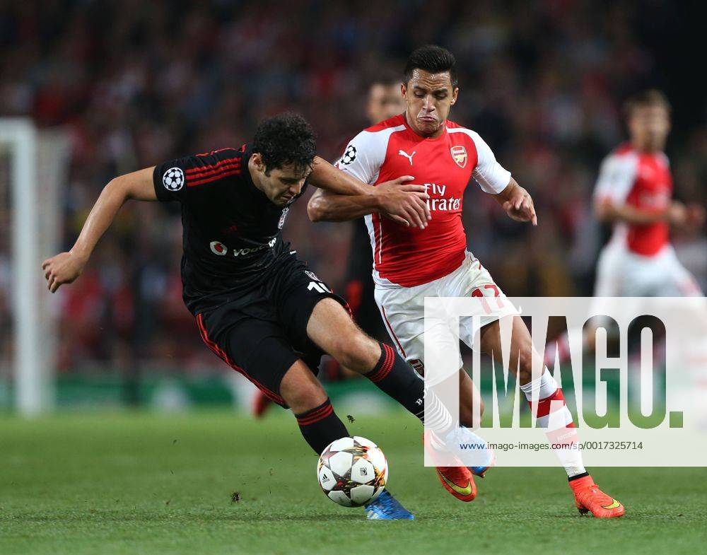 Arsenal s Alexis Sanchez tussles with Besiktas Olcay Sahan - UEFA Champions League, Play-off Second Leg - Emirates Stadium - England - 27th August 2014 - Picture David Klein Sportimage .