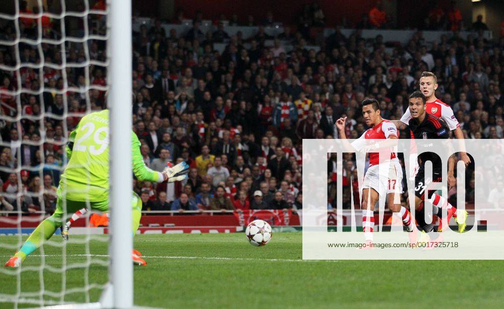 Arsenal s Alexis Sanchez scoring his sides opening goal - UEFA Champions League, Play-off Second Leg - Emirates Stadium - England - 27th August 2014 - Picture David Klein Sportimage .